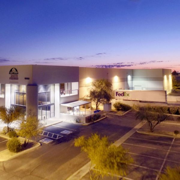Exterior view of the Smith-Southwestern headquarters and warehouse facility at 1850 N Rosemont in Mesa, Arizona at sunset