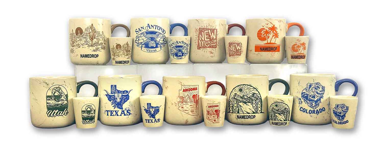A wholesale display of cream marble-textured ceramic mugs and matching shot glasses with single-color printed designs for Utah, Texas, Arizona, Colorado, and customizable name-drop placeholders