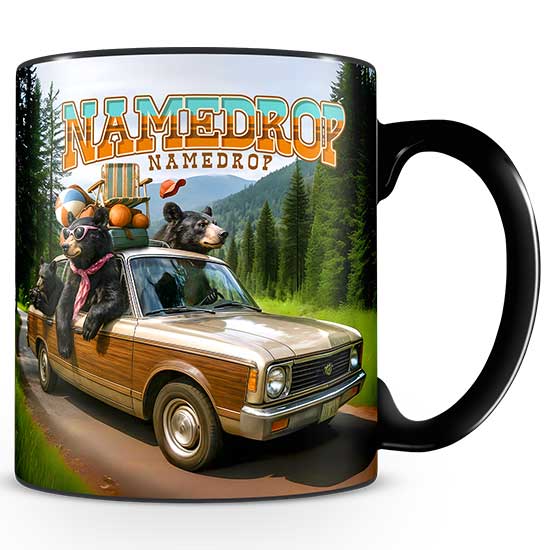 A black sublimated ceramic mug featuring a colorful full-wrap illustration of black bears driving a vintage wood-paneled station wagon packed with camping gear, with a bold NAMEDROP text placeholder