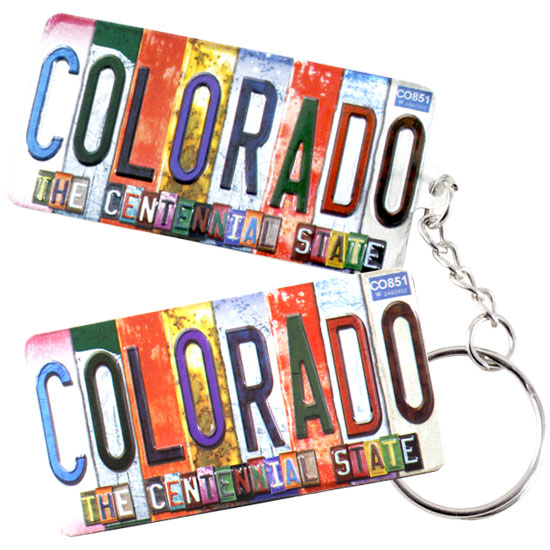 A wholesale custom Colorado souvenir keychain featuring a colorful, distressed license plate design with the text Colorado The Centennial State
