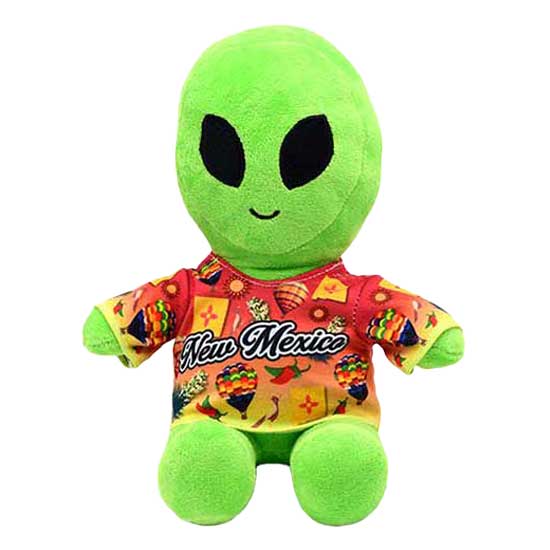 A custom wholesale green alien plush stuffed animal toy wearing a colorful New Mexico themed shirt decorated with hot air balloons and chili peppers